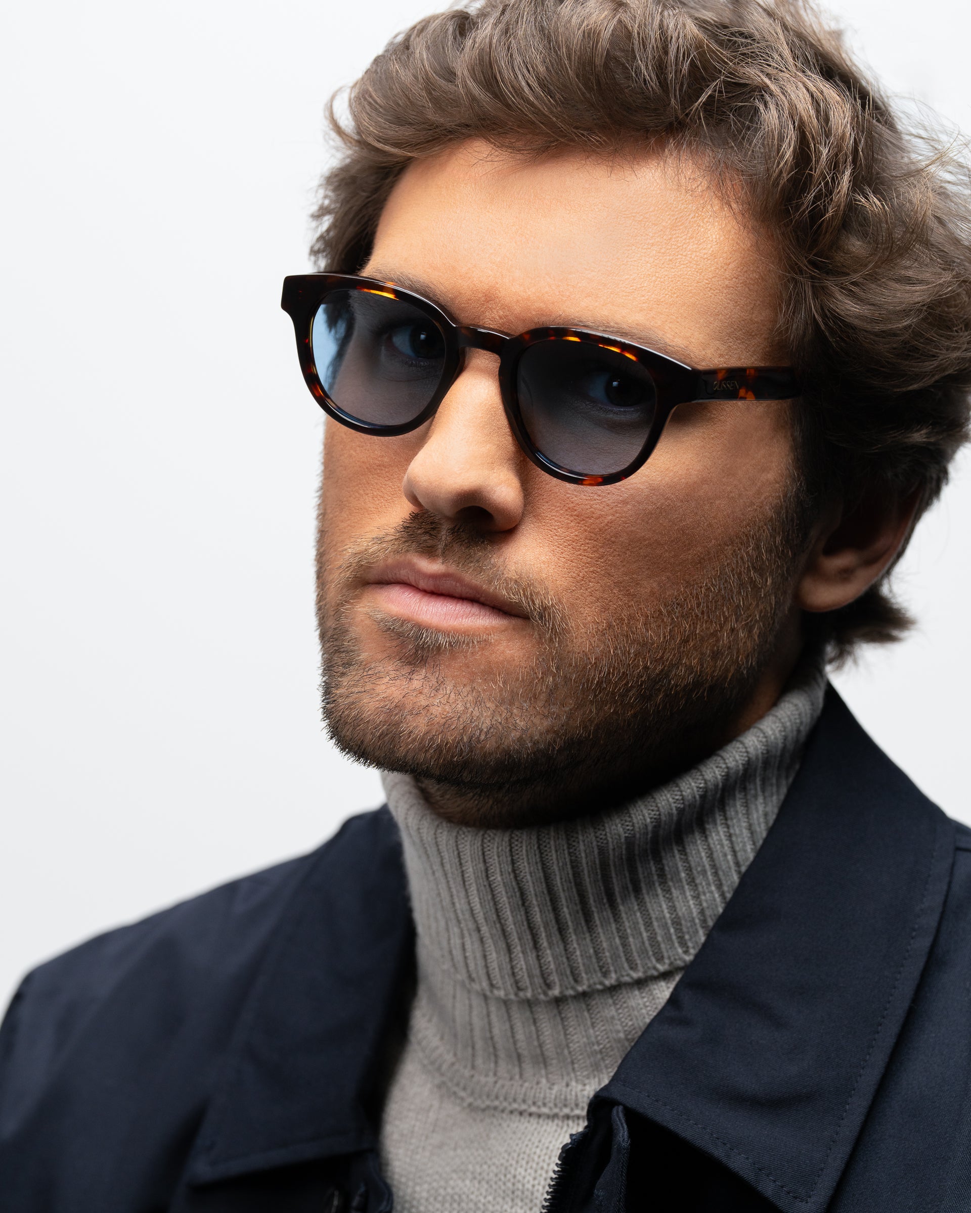 Milo Havana round sunglasses blue lenses man wearing 