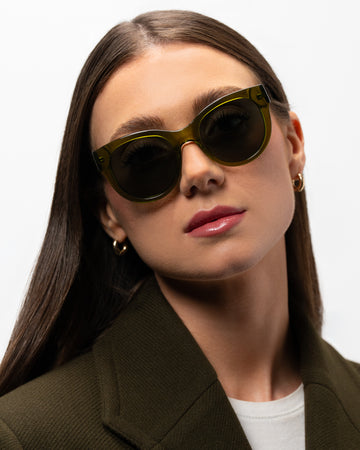 Olivia Khaki round sunglasses woman wearing
