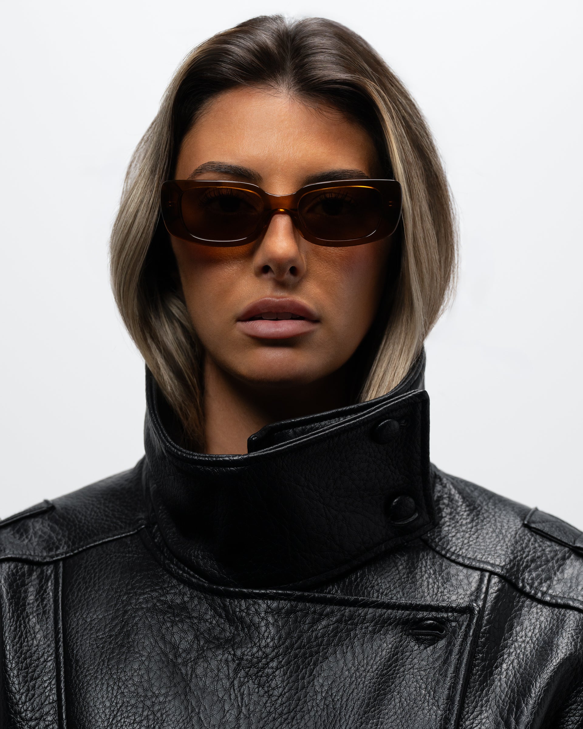 Trini Transparent Brown rectangular sunglasses woman wearing