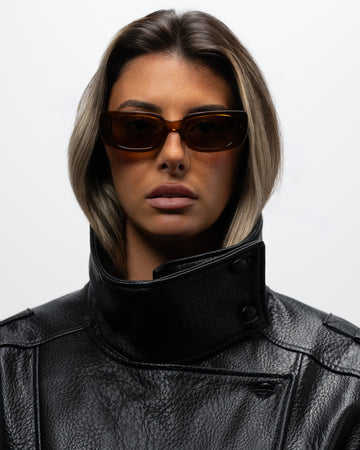Trini Transparent Brown rectangular sunglasses woman wearing